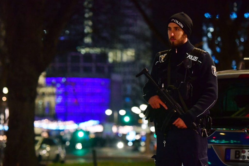 A policeman stands near the site where a truck speeded into a christmas market in Berlin, on December 19, 2016 killing nine persons and injuring at least 50 people. / AFP / John MACDOUGALL (Photo credit should read JOHN MACDOUGALL/AFP/Getty Images)