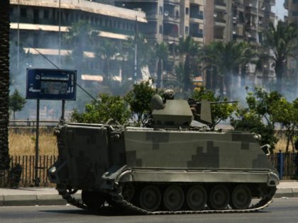 A Lebanese army M113 armored personnel carrier (APC) patrols the streets of the northern Lebanese city of Tripoli on 02 June 2012. Clashes between pro- and anti-Syrian regime gunmen killed at least six people and wounded 21 others in the city. AFP PHOTO (Photo credit should read -/AFP/GettyImages)
