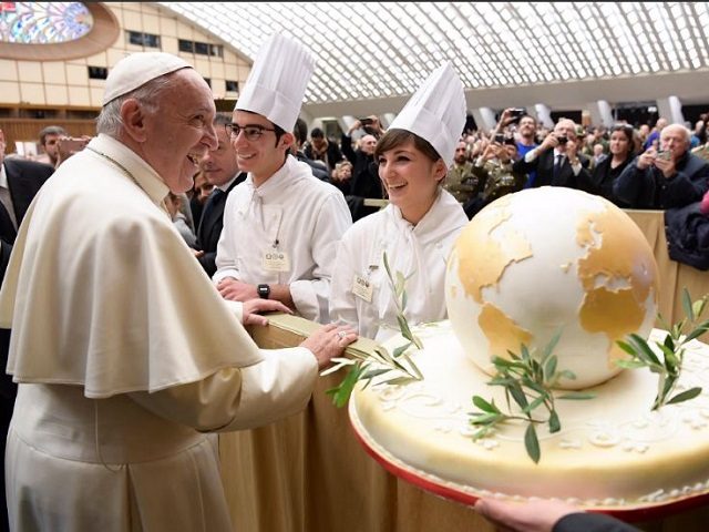 Chefs present early birthday cake to Pope Francis Wednesday.