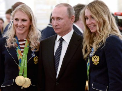 Putin Olympic women (Associated Press)