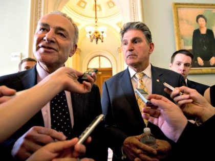 Sens. Chuck Schumer, D-N.Y., left, and Joe Manchin, D-W.Va. speak to reporters as they walk from Senate Majority Leader Harry Reid's, D-Nev., office on Capitol Hill in Washington, Tuesday, April 9, 2013, after a meeting on gun control. Reid's determination to stage a vote came despite continued inconclusive talks between …
