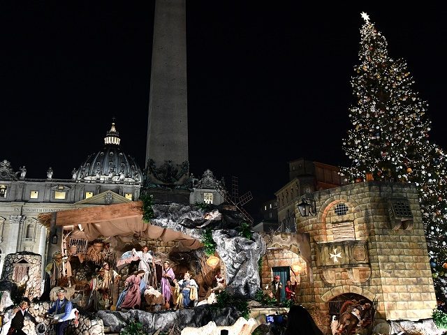 The Christmas tree (R) and the nativity scene (C) are pictured at the Saint Peter's s
