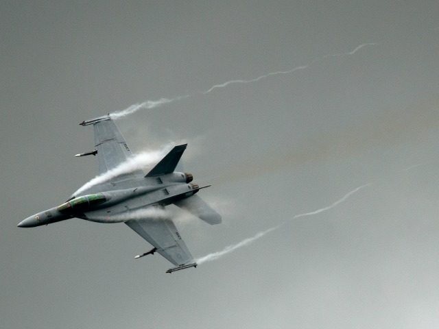 An F-18 takes part in a flying display at the Farnborough International Airshow in Hampshire, southern England, on July 9, 2012. Boeing was set to steal a march over European rival Airbus at the Farnborough airshow which began on Monday, with the US planemaker expected to secure big orders for …