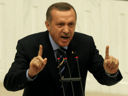 Turkey's Prime Minister Recep Tayyip Erdogan addresses the members of parliament during a debate at the Turkish Parliament in Ankara, on November 13, 2009. Turkey's parliament is set to discuss details of a plan to give wider rights to Kurds, including allowing them to restore Kurdish names to their towns. …