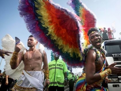 RIO DE JANEIRO, BRAZIL - DECEMBER 11: Revelers celebrate during the annual gay pride parade on Copacabana beach December 11, 2016 in Rio de Janeiro, Brazil. Marchers called for expanded rights and protection from violence for those in the LGBT (Lesbian, Gay, Bisexual and Transgender) community. (Photo by Mario Tama/Getty …