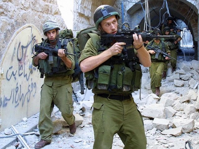 Israeli soldiers patrol 27 August 2003 the old quarter of the West Bank city of Nablus, wa
