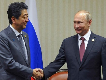 LIMA, PERU - NOVEMBER 19, 2016: Japan's Prime Minister Shinzo Abe (L) and Russia's President Vladimir Putin shake hands at a meeting on the sidelines of the 2016 Asia-Pacific Economic Cooperation summit, at the Swissotel Lima. Mikhail Klimentyev/Russian Presidential Press and Information Office/TASS (Photo by Mikhail Klimentyev\TASS via Getty Images)