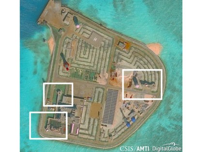 A satellite image shows what CSIS Asia Maritime Transparency Initiative says appears to be anti-aircraft guns and what are likely to be close-in weapons systems (CIWS) on the artificial island Johnson Reef in the South China Sea in this image released on December 13, 2016. Courtesy CSIS Asia Maritime Transparency …