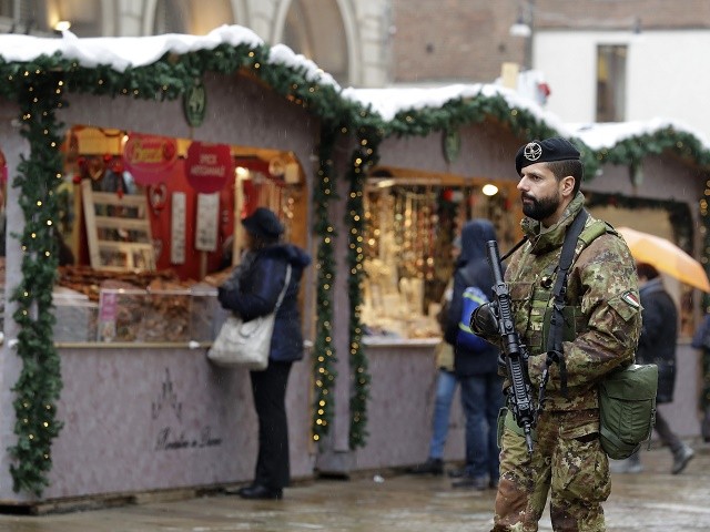 Italian soldiers patrol a Christmas market in Duomo square in Milan, Italy, Tuesday, Dec. 20, 2016 the day after a truck ran into a crowded Christmas market killing a number of people Monday evening in Berlin, Germany. (AP Photo/Antonio Calanni)