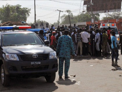 Emergency services, police and residents gather at the scene of a suicide bomb attack on a market in Maiduguri, after two girls approximately seven or eight years old blew themselves, killing themselves and wounding at least 17 others. The attack was not immediately claimed by the Boko Haram jihadist insurgency …