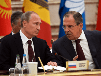 Russian President Vladimir Putin (L) speaks with Russian Foreign Affairs Minister Sergei Lavrov on October 10, 2014 during the Commonwealth of Independent States (CIS) leaders summit in Minsk. AFP PHOTO / POOL / ALEKSEY NIKOLSKY (Photo credit should read ALEKSEY NIKOLSKYI/AFP/Getty Images)