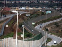 MELILLA, SPAIN - JANUARY 22: A general view of the border fence that limits Morocco from the Spanish enclave of Melilla on January 22, 2015 in Melilla, Spain. According to Spanish Police approximately 2,400 from the 5,000 immigrants entering Melilla last year were Syrians seeking asylum in various European countries. …