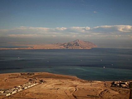 A picture taken on January 14, 2014 through the window of an airplane shows the Red Sea's Tiran (foreground) and the Sanafir (background) islands in the Strait of Tiran between Egypt's Sinai Peninsula and Saudi Arabia. Saudi King Salman on April 11, 2016 wrapped up a landmark five-day visit to …