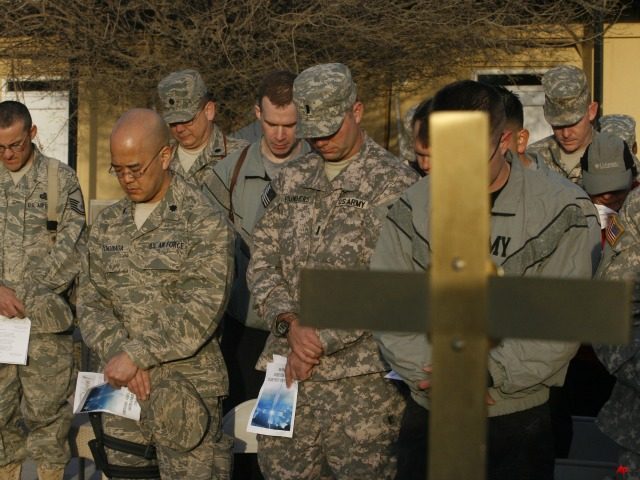 soldiers_praying_cross_AP