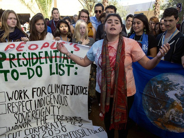 American students protest outside the UN climate talks during the COP22 international climate conference in Marrakesh in reaction to Donald Trump's victory in the US presidential election, on November 9, 2016. Stunned participants at UN climate talks in Marrakesh insisted that climate change denier Donald Trump cannot derail the global …