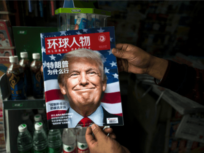 A copy of the local Chinese magazine Global People with a cover story that translates to 'Why did Trump win' is seen with a front cover portrait of US president-elect Donald Trump at a news stand in Shanghai on November 14, 2016. Chinese President Xi Jinping and US president-elect Donald …