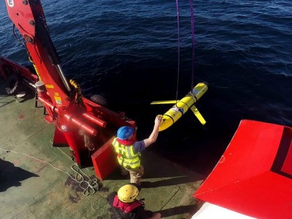 Crew members aboard the VOS Raasay recover U.S. and British Royal Navy ocean gliders taking part in the Unmanned Warrior exercise off the northwest coast of Scotland on October 8, 2016. Courtesy Santiago Carrizosa/U.S. Navy/Handout via REUTERS