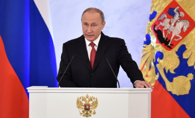 Russian President Vladimir Putin addresses the Federal Assembly of both houses of parliame