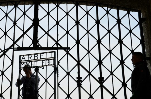 Workers attach a new entrance gate at the former concentration camp in Dachau, southern Ge