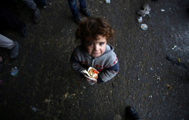 A Syrian child, who fled with his family from rebel-held areas of Aleppo, pictured at a sh