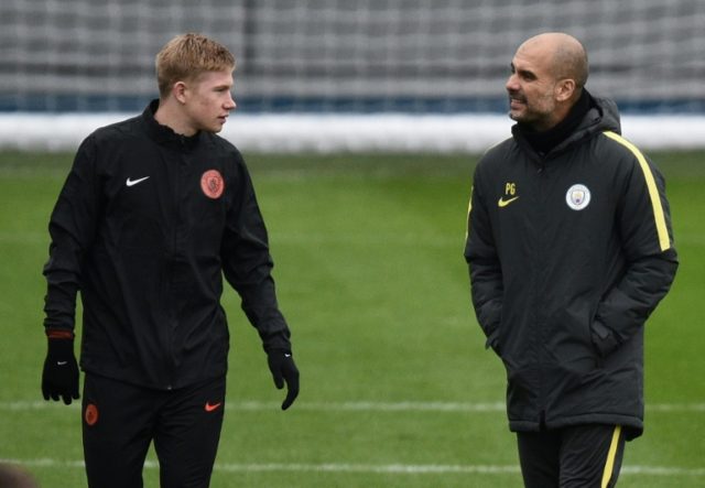 Kevin De Bruyne (L), with Manchester City coach Pep Guardiola at a training session, was a