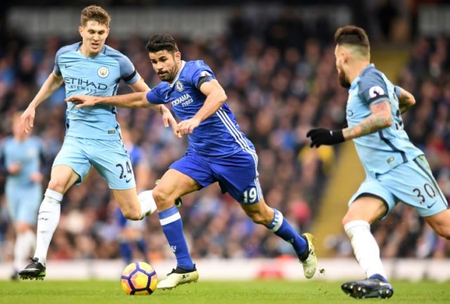 Chelsea's striker Diego Costa (C) vies with Manchester City's defender John Stones (L) and