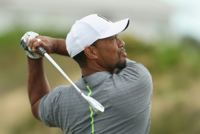 Tiger Woods of the United States hits his tee shot on the second hole during round three o