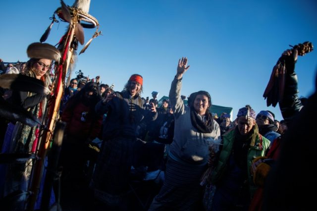 Activists celebrate at Oceti Sakowin Camp on the edge of the Standing Rock Sioux Reservati