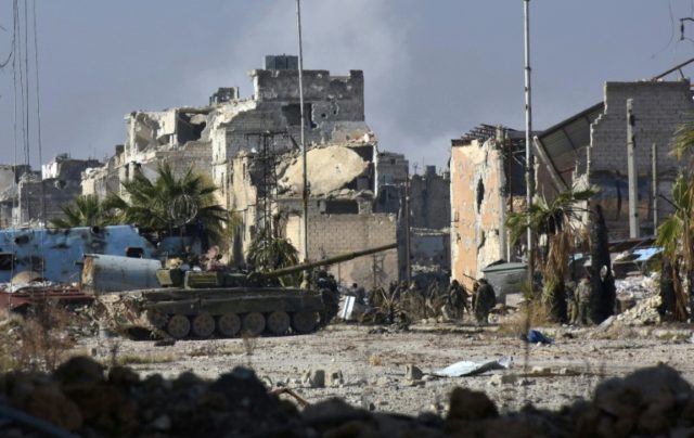 Syrian pro-government forces advance in the Myessar district of east Aleppo on December 4,