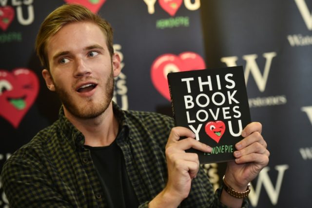 Swedish video game commentator Felix Kjellberg, aka PewDiePie poses with his new book, 'Th