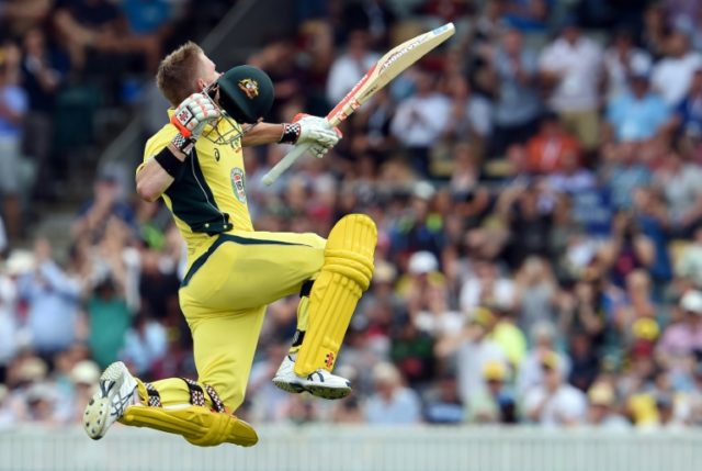 Australia's David Warner celebrates reaching his century against New Zealand in the second