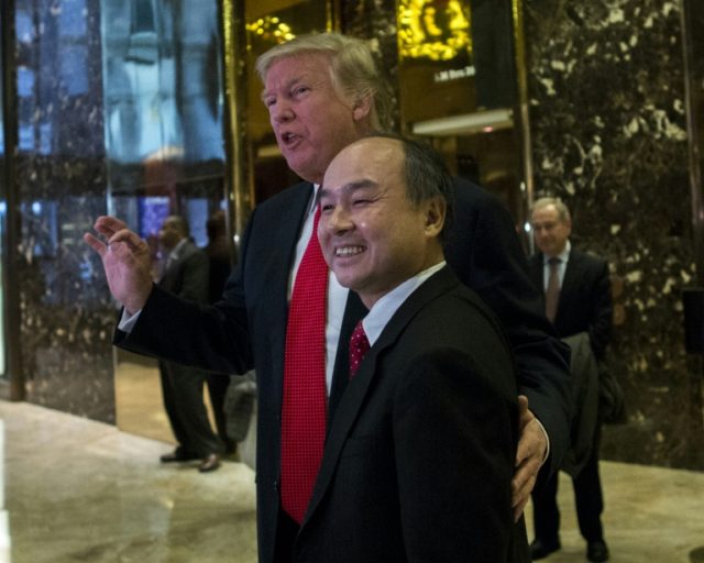 President-elect Donald Trump talks to the media with SoftBank Group Corp. founder and Chie