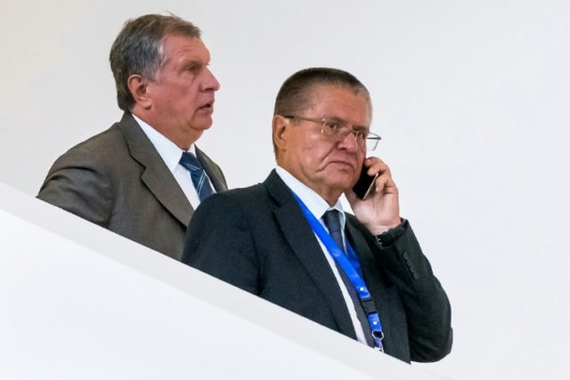 Rosneft CEO Igor Sechin (L) and Russian Economy Minister Alexei Ulyukayev attend a meeting