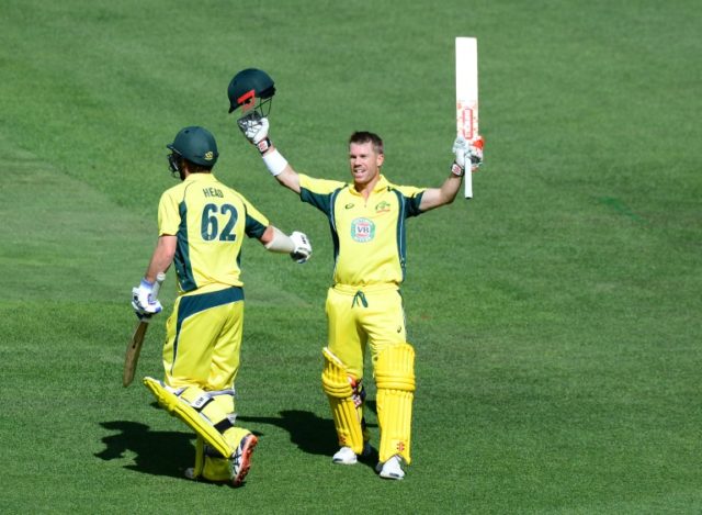 Australia's David Warner celebrates reaching his 11th ODI century against New Zealand in M
