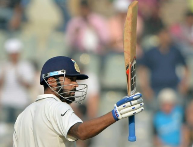 India's Murali Vijay celebrates reaching his half-century on the second day of the fourth