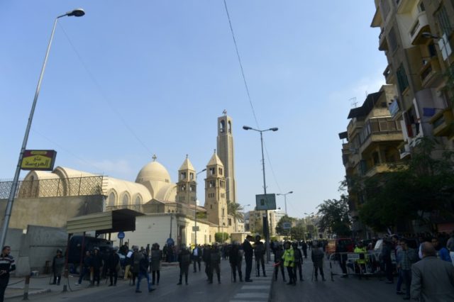 Egyptian security forces gather at the site of an explosion at the Saint Mark's Coptic Ort