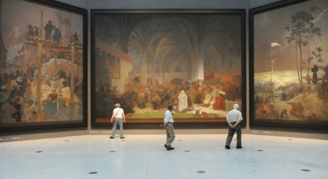 Visitors look at paintings of the Slav Epic, a cycle of 20 allegories tracing the history
