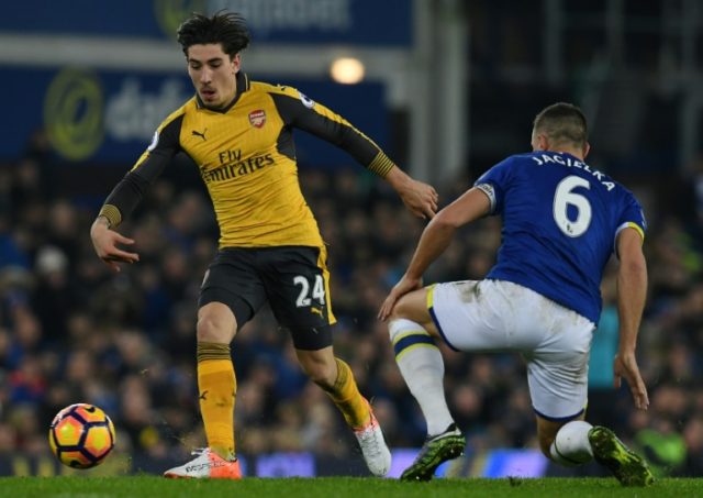 Arsenal's Hector Bellerin (L) fights for the ball with Everton's Phil Jagielka during thei