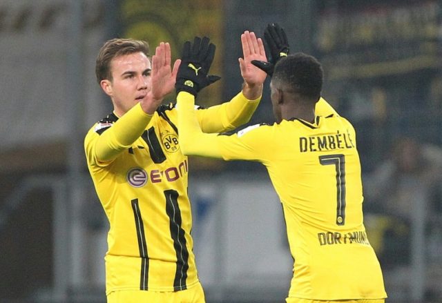Dortmund's midfielder Mario Goetze celebrates scoring the 1-1 with Dortmund's midfielder O