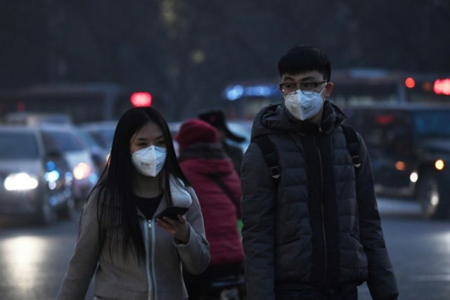 Pedestrians have been wearing masks to protect themselves from pollution in Beijing, as sm