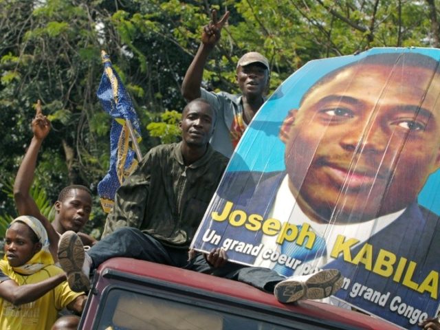 Supporters of DR Congo President Joseph Kabila parade his photograph in Kinshasa in November 2006