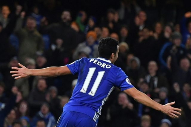 Chelsea's midfielder Pedro celebrates scoring the team's third goal during the football ma