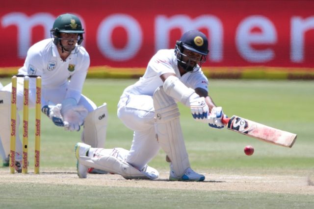 Sri Lanka batsman Dimuth Karunaratne plays a shot during the fourth day of the first Test
