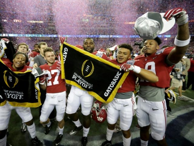 Players from the Alabama Crimson Tide celebreate after beating the Washington Huskies 24 t