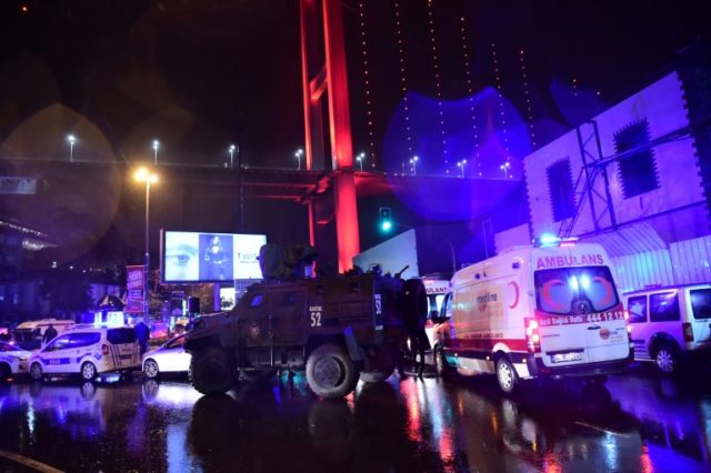 Turkish special force police officers and ambulances are seen at the site of an armed atta