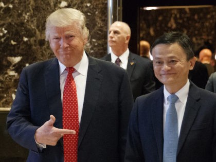 President-elect Donald Trump stands with Alibaba Executive Chairman Jack Ma as they walk to speak with reporters after a meeting at Trump Tower in New York, Monday, Jan. 9, 2017. (AP Photo/Evan Vucci)