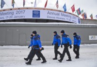 Switzerland Davos Forum Swiss police officers walk past the congress center where the annual meeting, World Economic Forum, will take place in Davos, Switzerland, Sunday Jan. 15, 2017. Business and world leaders are gathering for the annual meeting in Davos. (AP Photo/Michel Euler)(AP Photo/Michel Euler)