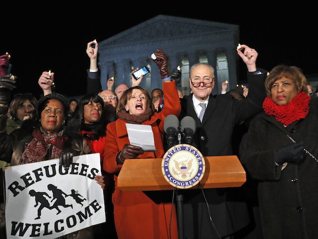 Rep. Sheila Jackson Lee D-Texas, left, House Minority Leader Nancy Pelosi of Calif., Senate Minority Leader Chuck Schumer of New York, Rep. Brenda Lawrence, D-Mich., right, and other members of Congress, hold small candles aloft in front of the Supreme Court during a news conference about President Donald Trump's recent …