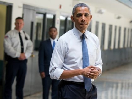 July 16, 2015, file photo, President Barack Obama pauses as he speaks at the El Reno Feder