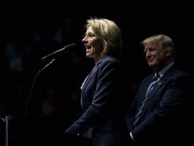 Betsy DeVos, his nominee for Secretary of Education, speaks as President-elect Donald Trum